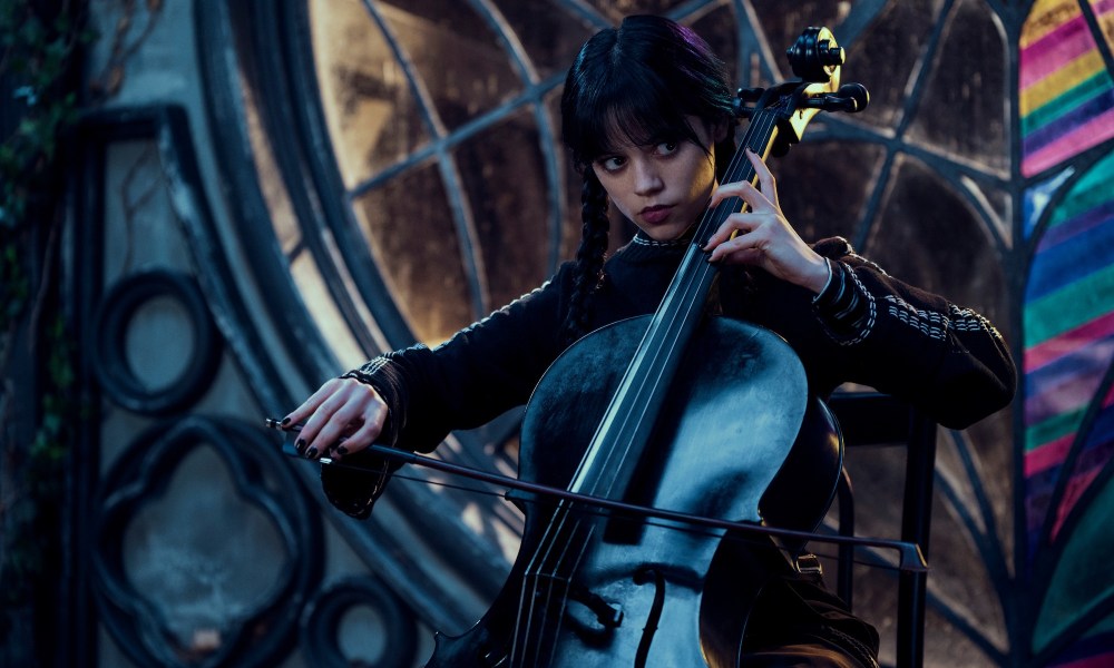 A girl plays the cello in Wednesday.