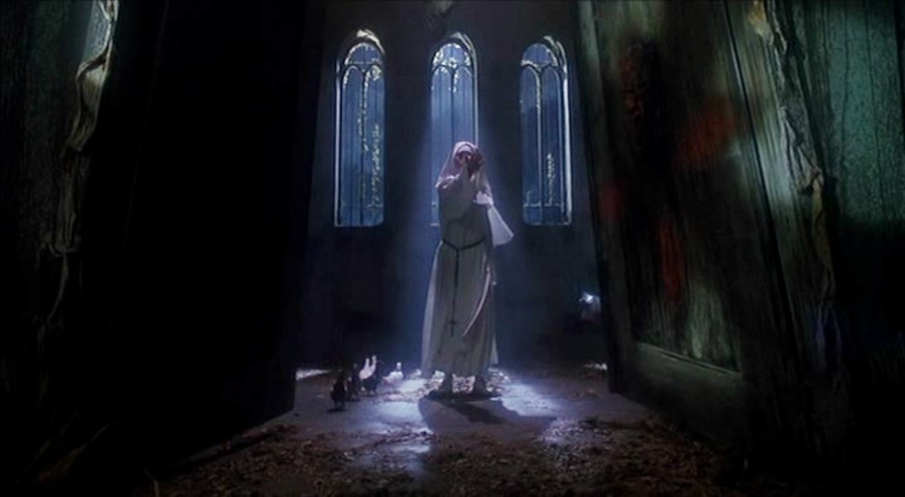 A nun stands in a church in A Nightmare on Elm Street 5: The Dream Child.