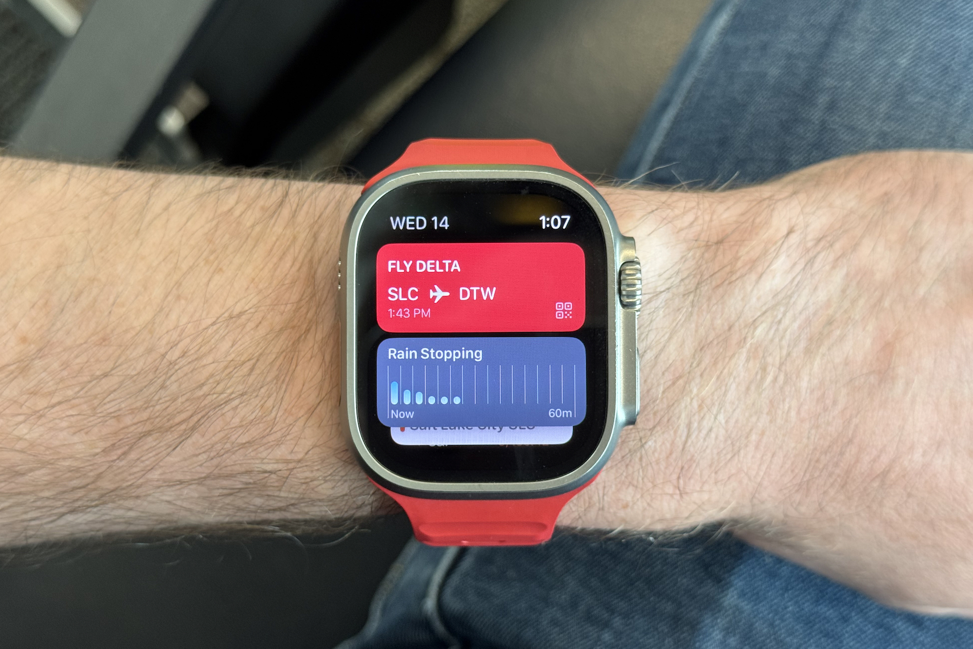 A boarding pass on an Apple Watch Ultra 2.