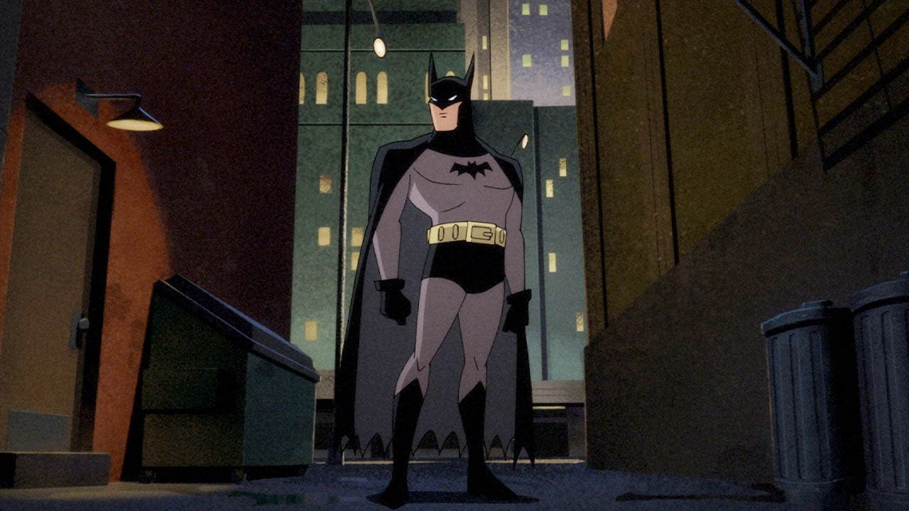 Batman se encuentra en un callejón oscuro en Batman: Caped Crusader.