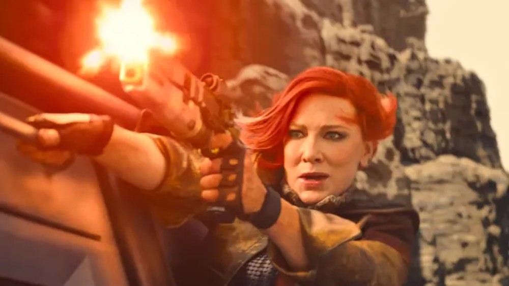 Uma mulher dispara uma arma em Borderlands.