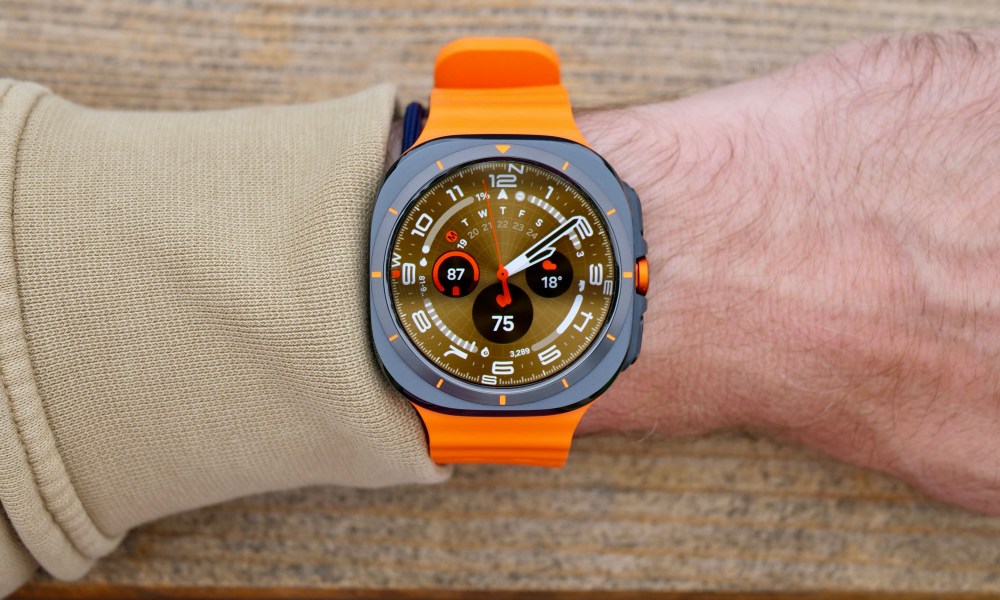 A person wearing the Samsung Galaxy Watch Ultra showing the Ultra Analogue watch face.