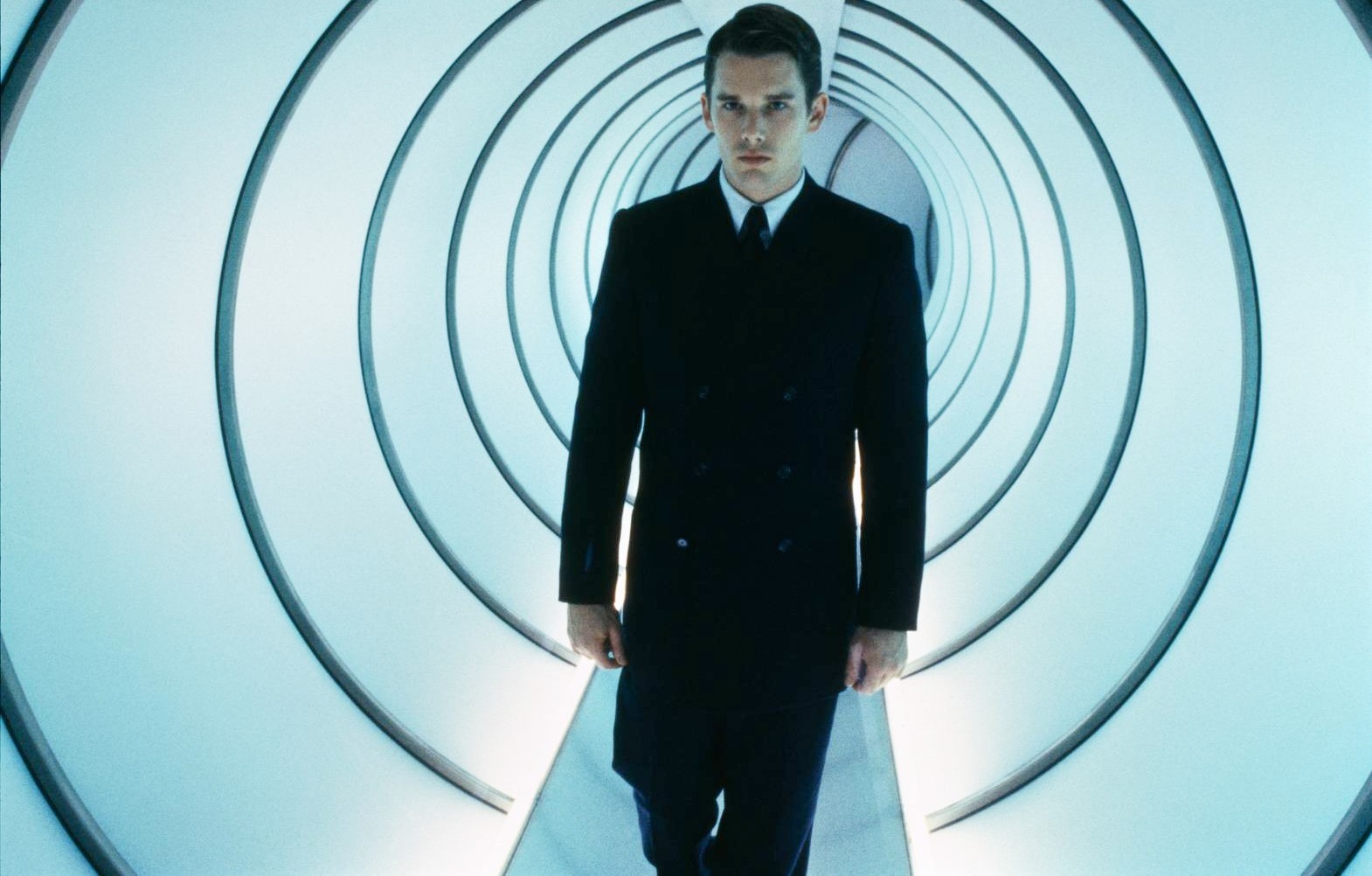 A man walks down a hallway in Gattaca.