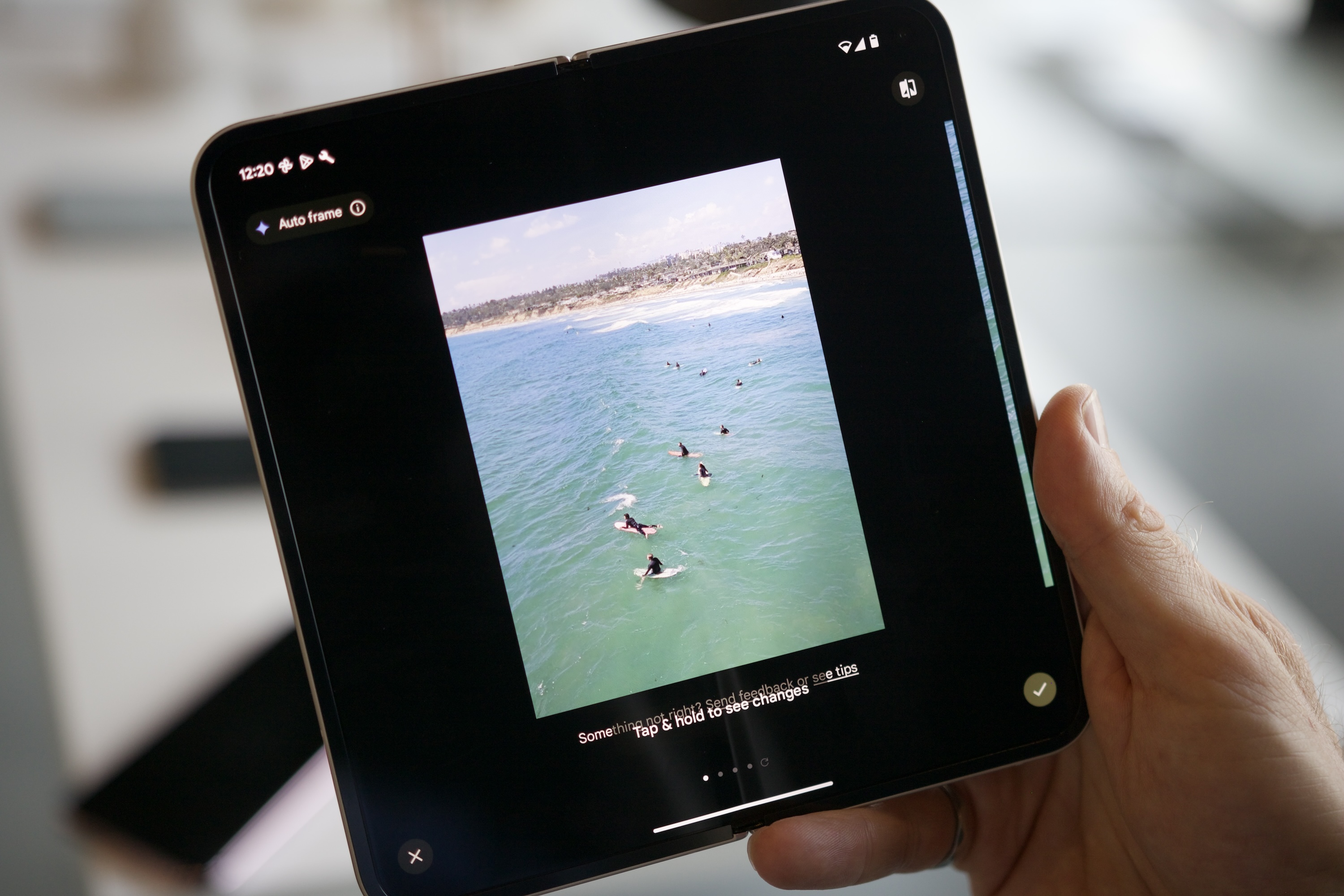 A demonstration of the Auto Frame feature on a Google Pixel 9.