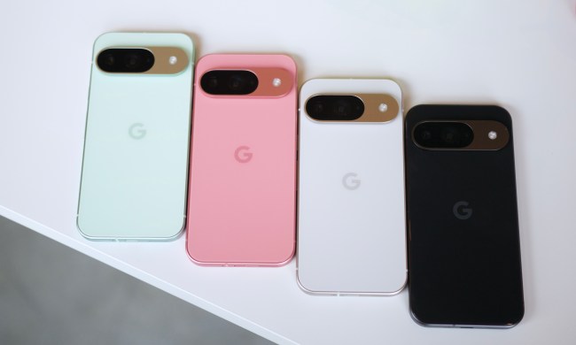 The Google Pixel 9 in green, pink, white, and black colors, all laying on a white table.