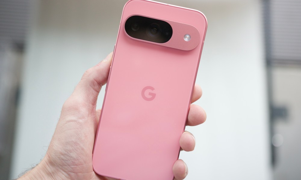 Someone holding a pink Google Pixel 9.