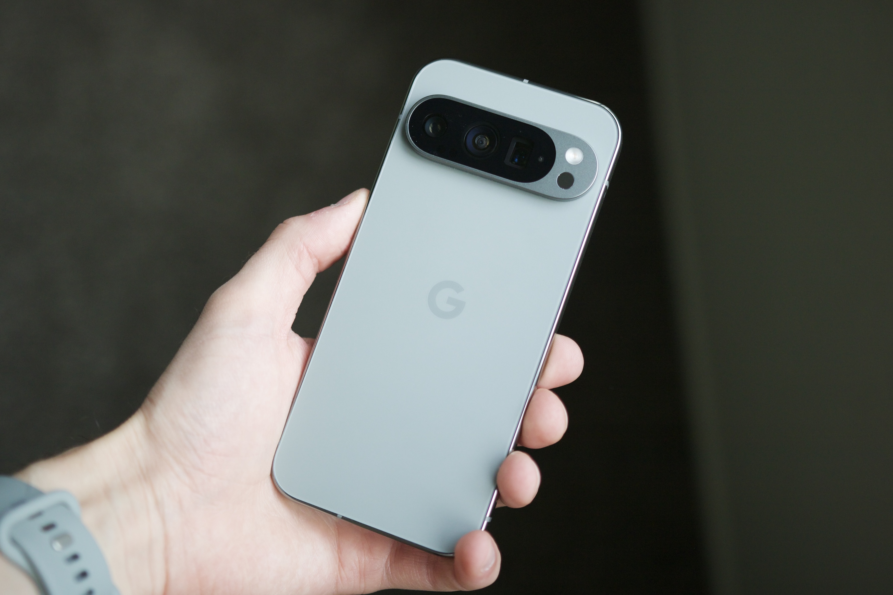 Someone holding the Hazel Google Pixel 9 Pro.