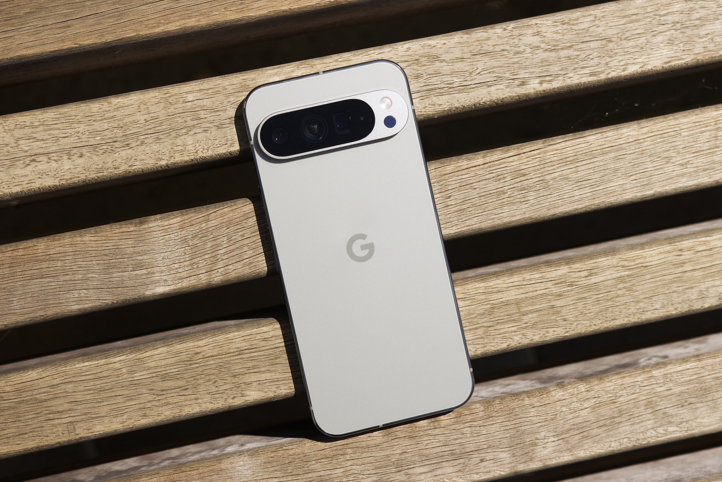 The Google Pixel 9 Pro XL laying on a bench.