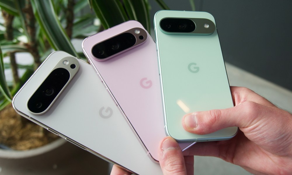 Someone holding the Google Pixel 9 Pro XL, Pixel 9 Pro, and Pixel 9.