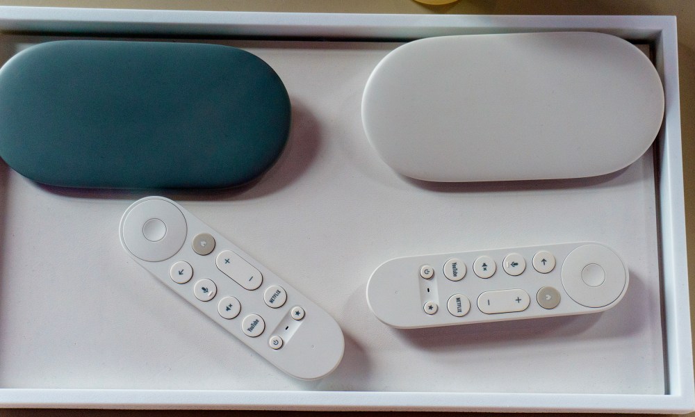 The two colors of Google TV Streamer — hazel and porcelain — with their remote controls.