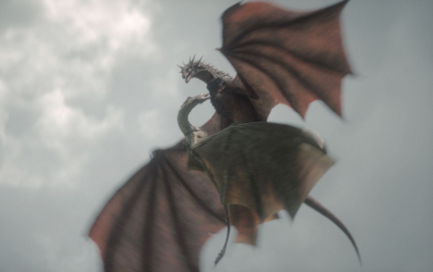 Two dragons duel in the sky in House of the Dragon.