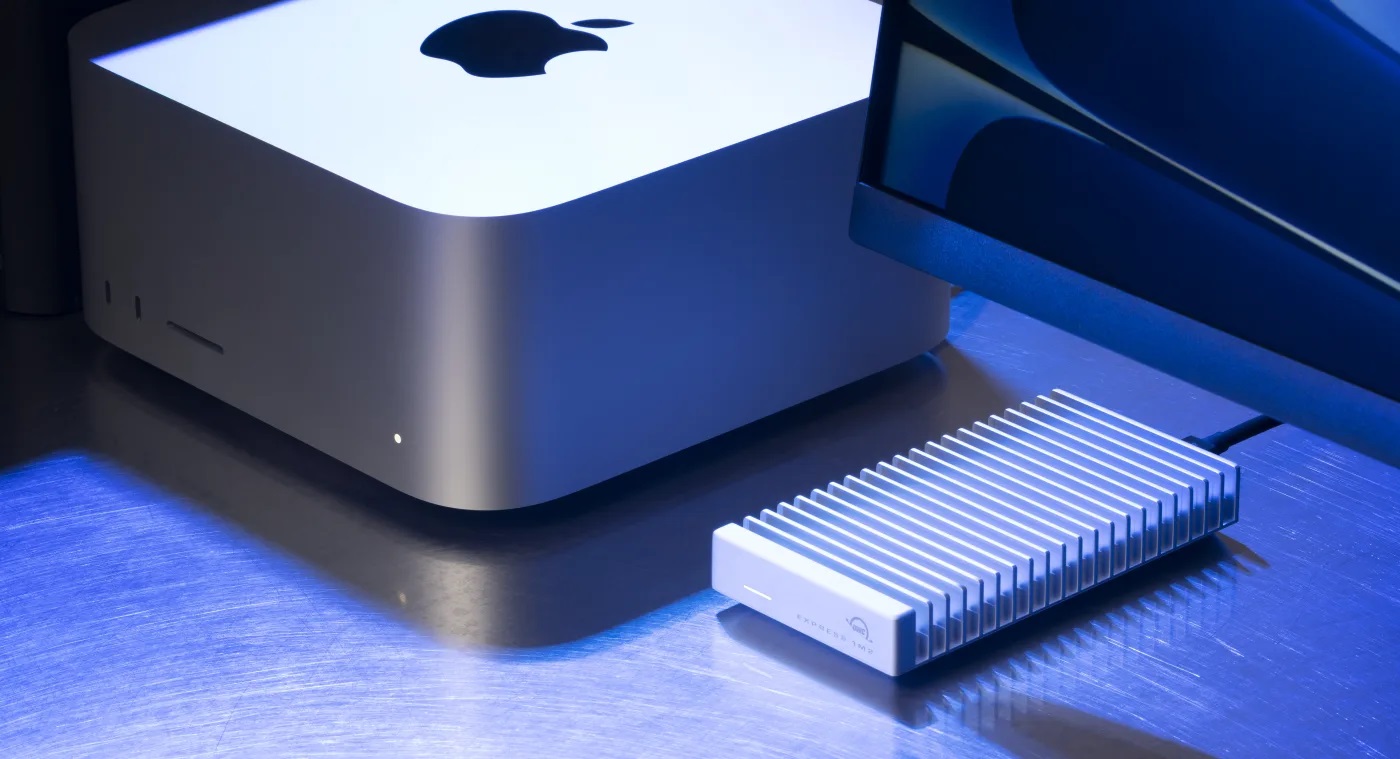 The OWC Express 1M2 external SSD next to the Apple Mac Studio.