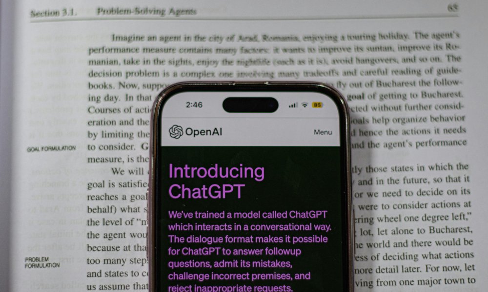 chatGPT on a phone on an encyclopedia