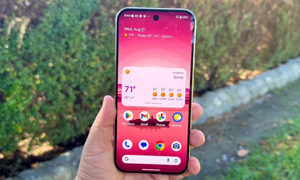 Pixel 9 Pro in Rose Quartz showing home screen.