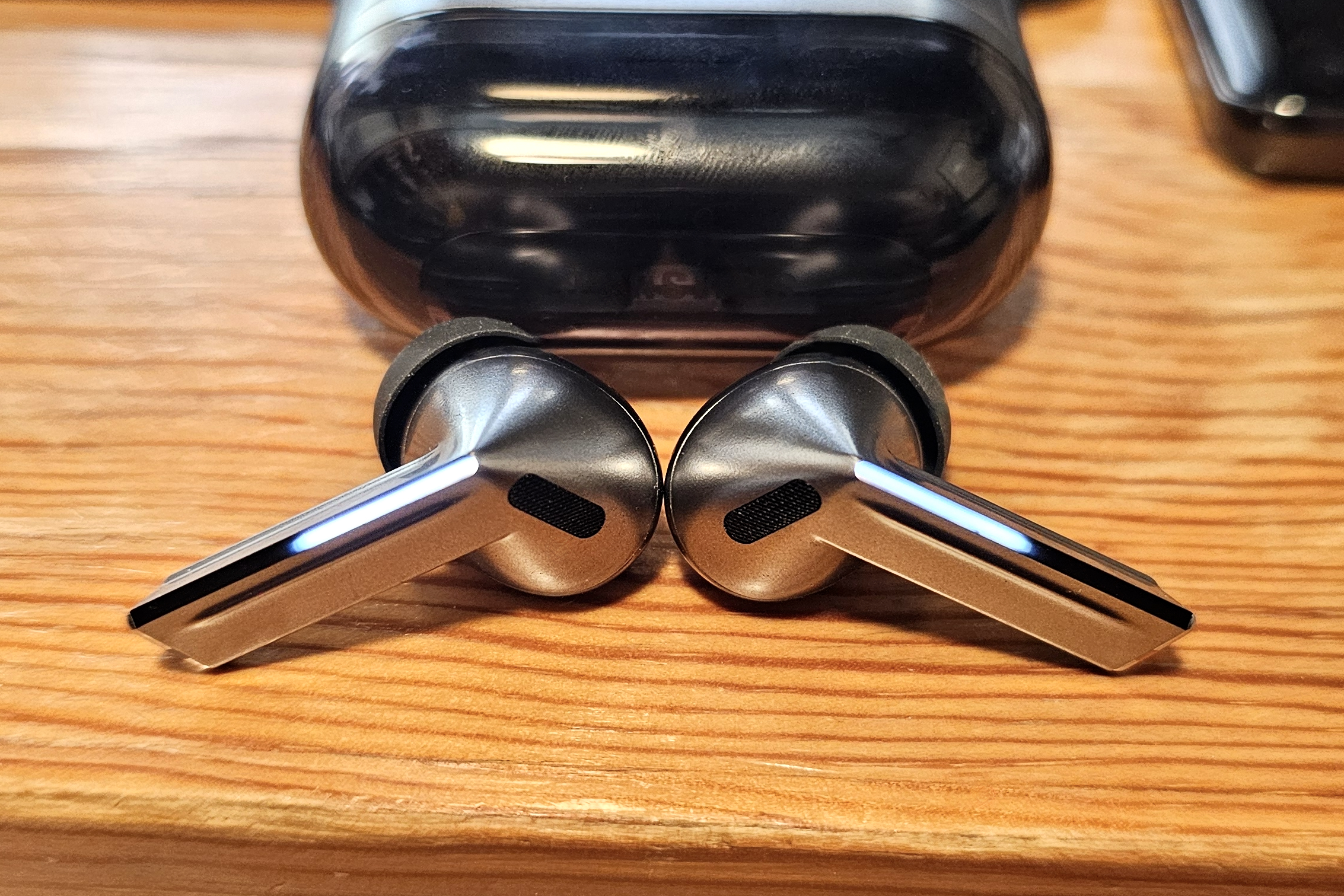 Samsung Galaxy Buds 3 Pro with blade lights illuminated.