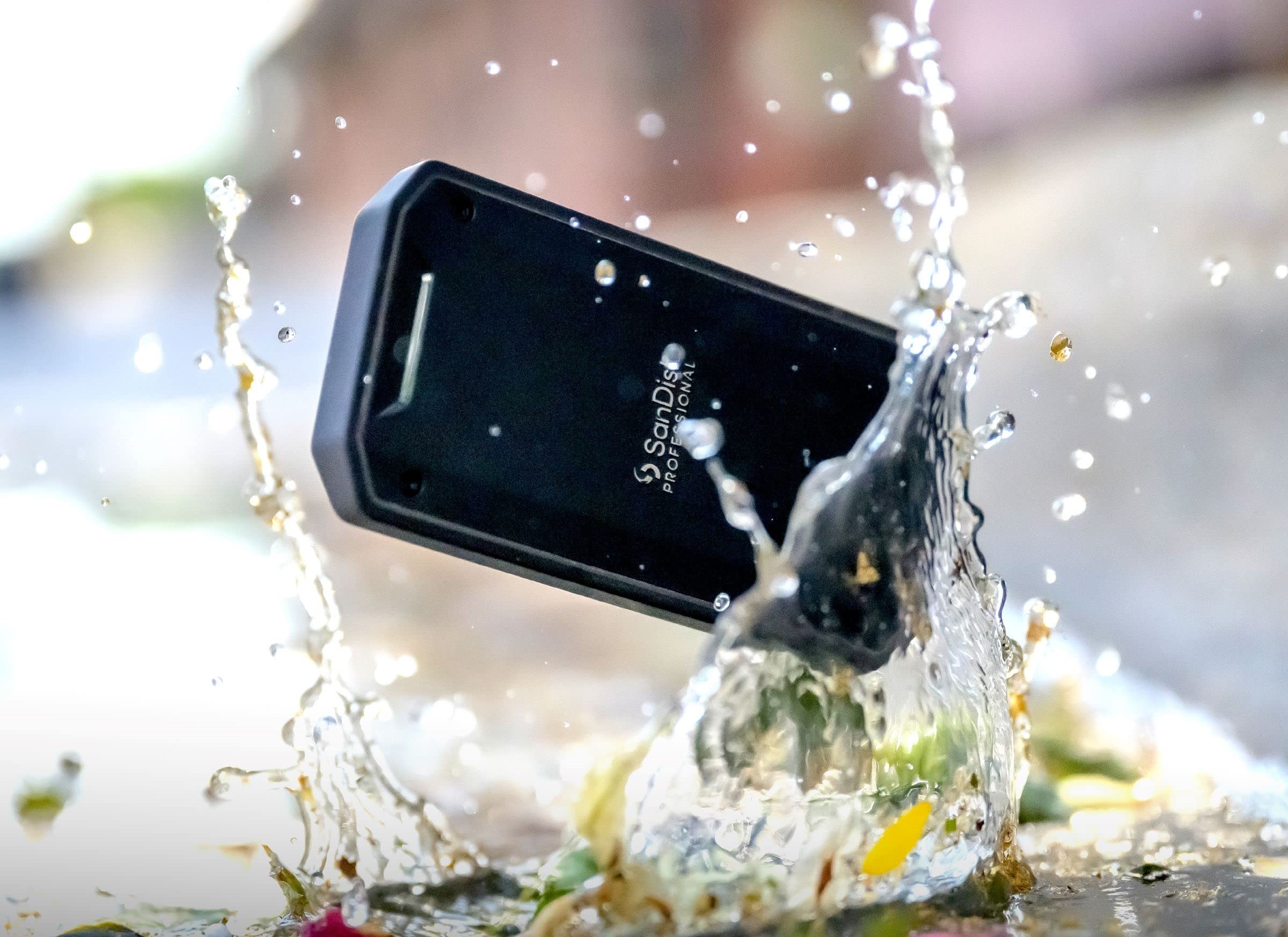 The SanDisk Pro-G40 external SSD with water splashes.