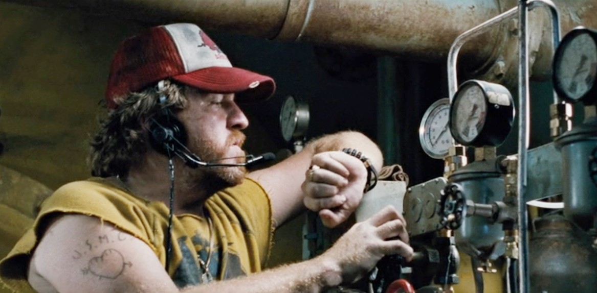 A man checks machinery in The Abyss.