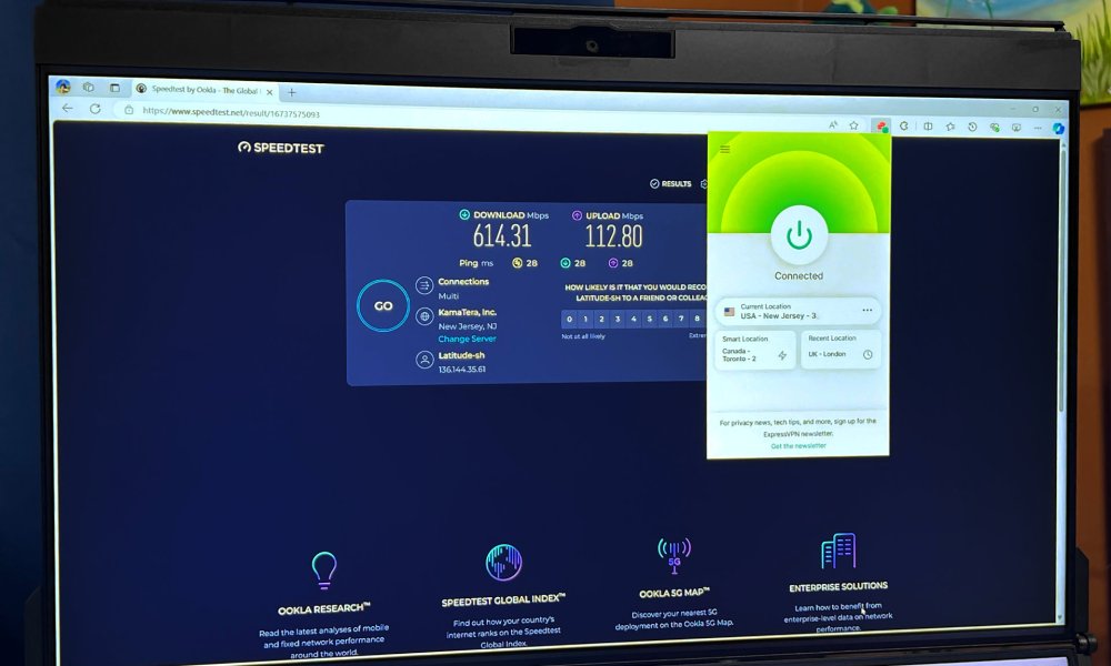 A PC monitor shows ExpressVPN's browser extension in use while testing its speed.