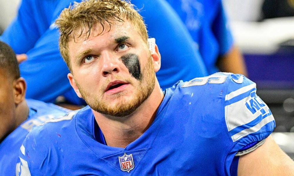 Aidan Hutchinson of the Detroit Lions sits down and stares.