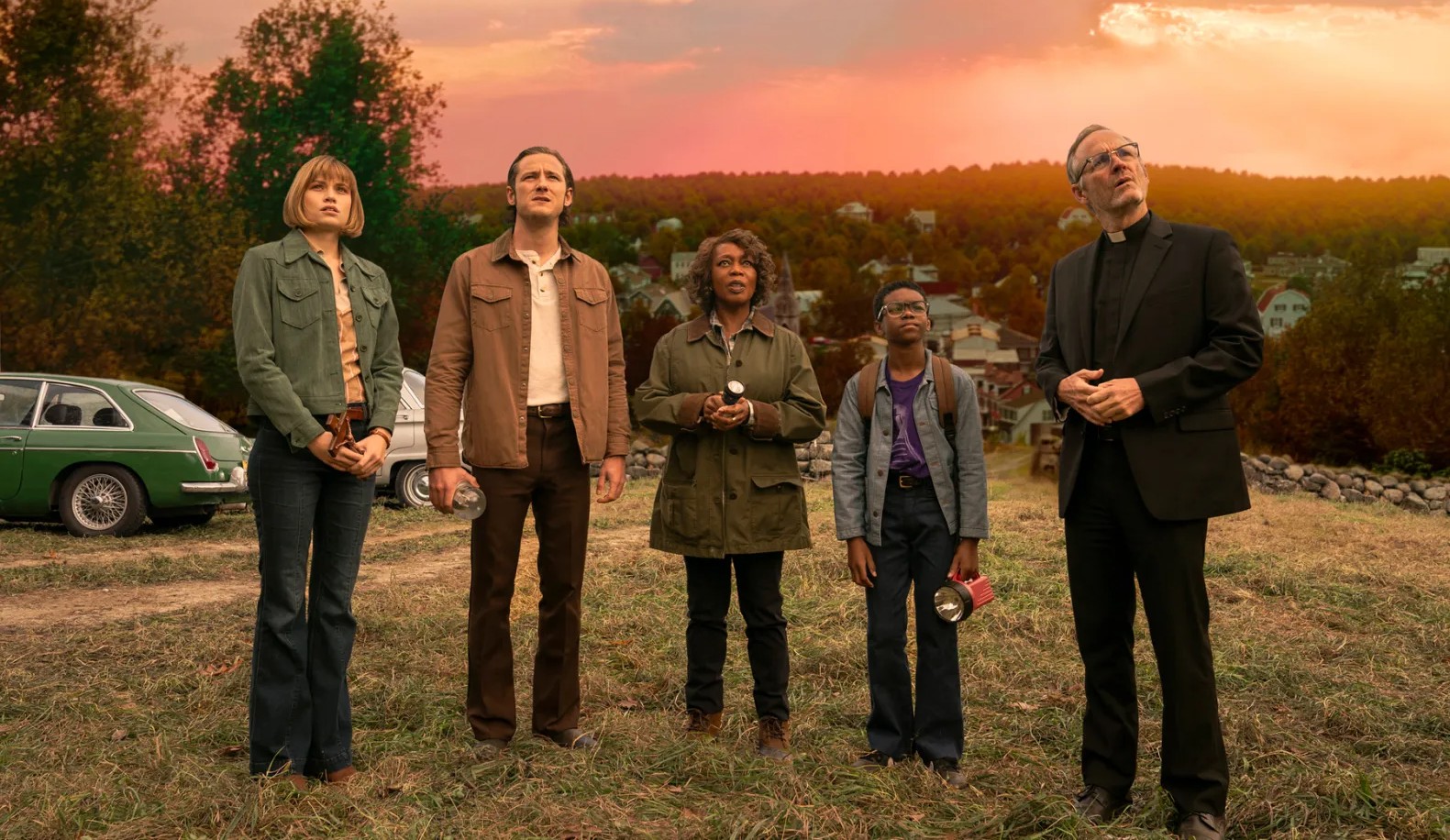 5 people stand in a field in Salem's Lot.