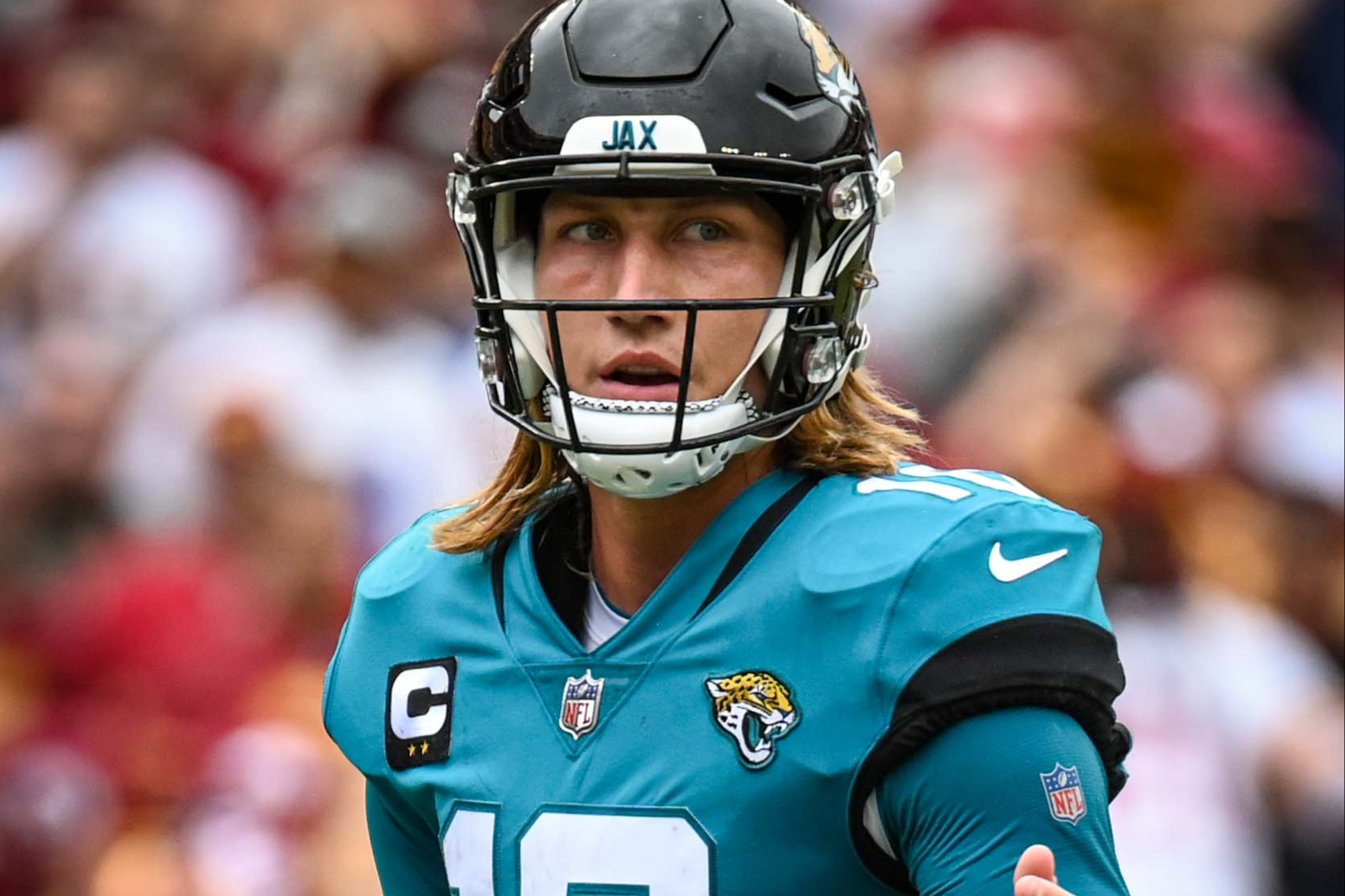 Trevor Lawrence stares at the soccer field.