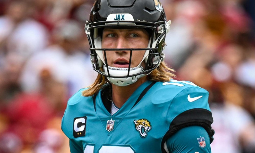 Trevor Lawrence stares on the football field.