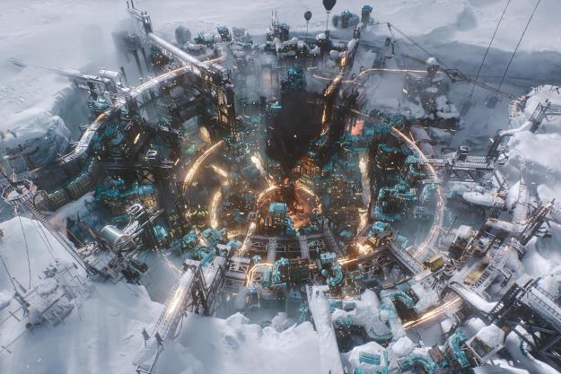 A city sits in a crater in Frostpunk 2.