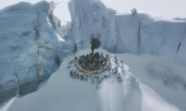 A city sits on a snowy hill in Frostpunk 2.