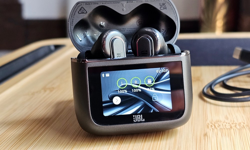 JBL Tour Pro 3 in their open charging case.