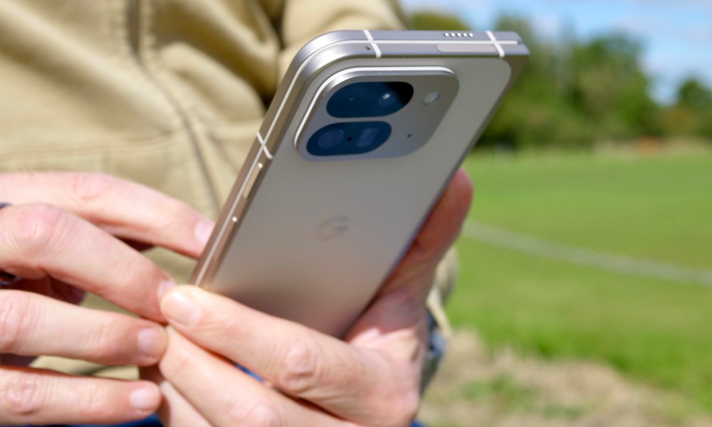 A person holding the closed Google Pixel 9 Pro Fold.