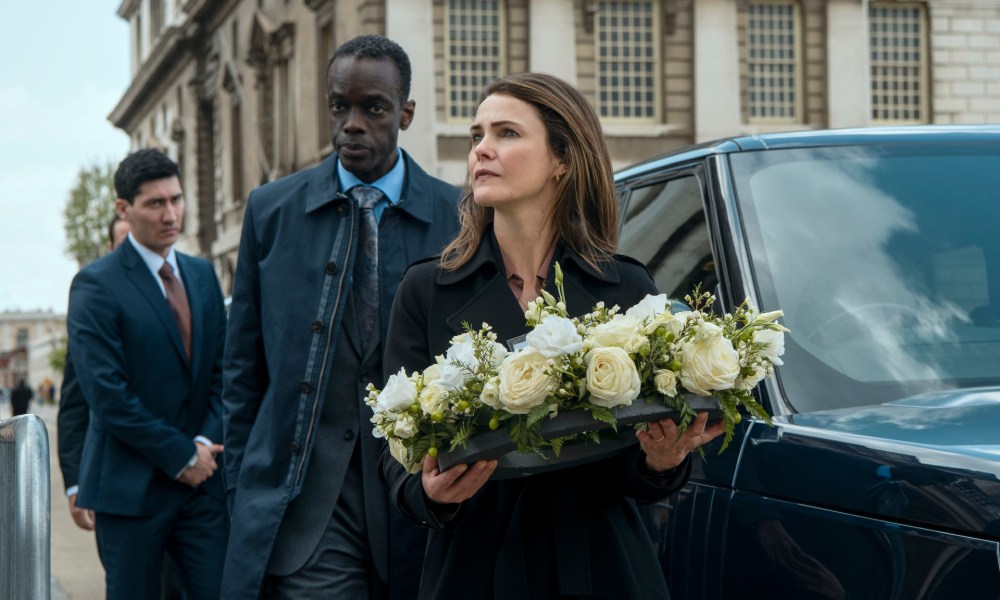 A woman hold flowers in The Diplomat.