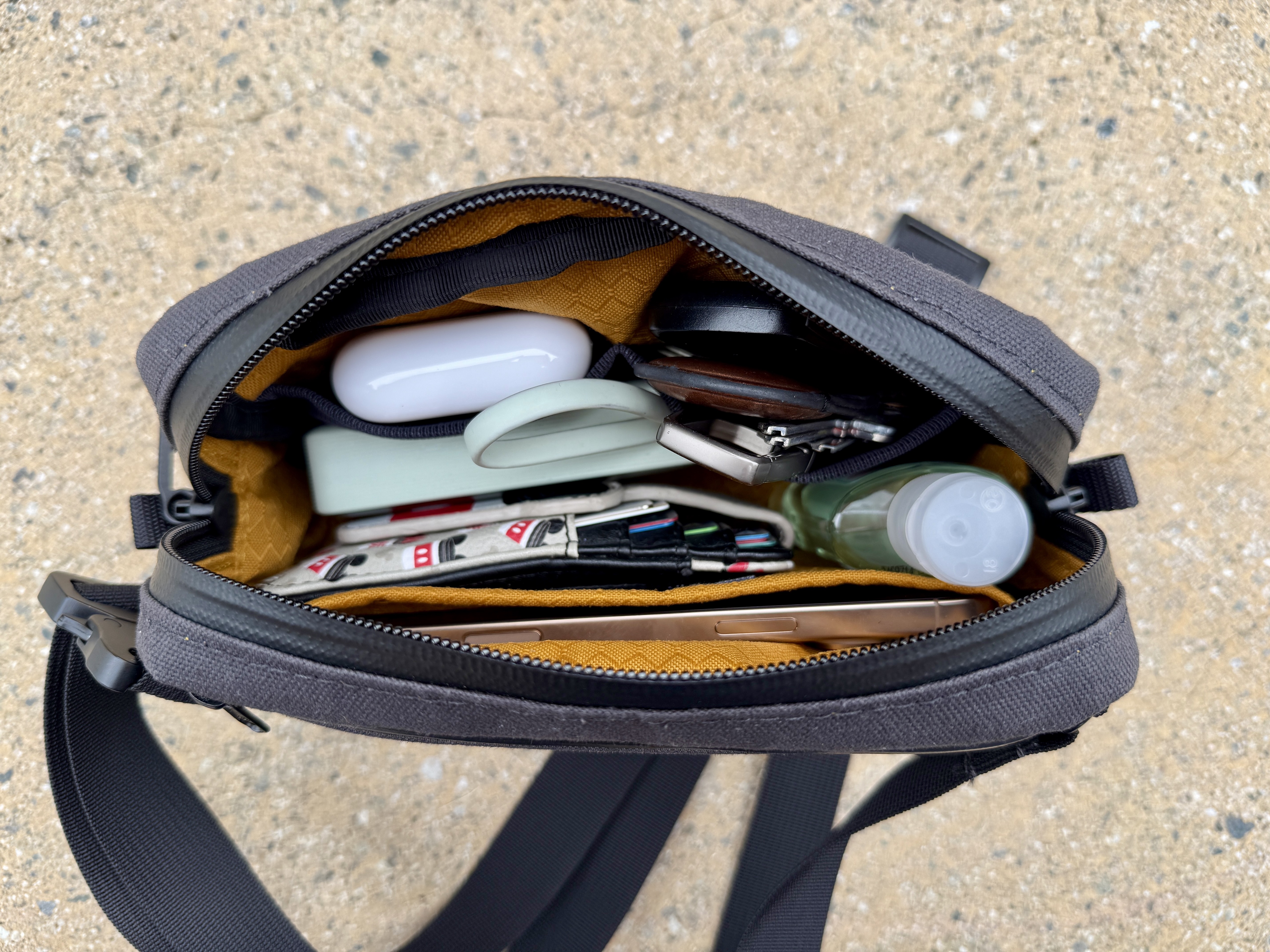 Waterfield Designs Shinjuku Sling in black, showing the interior when full.