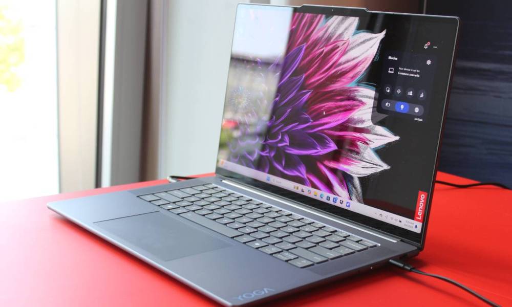 A Yoga Slim 7i on a red table.