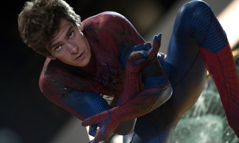 Andrew Garfield poses as Spider-Man with his hands crossed.