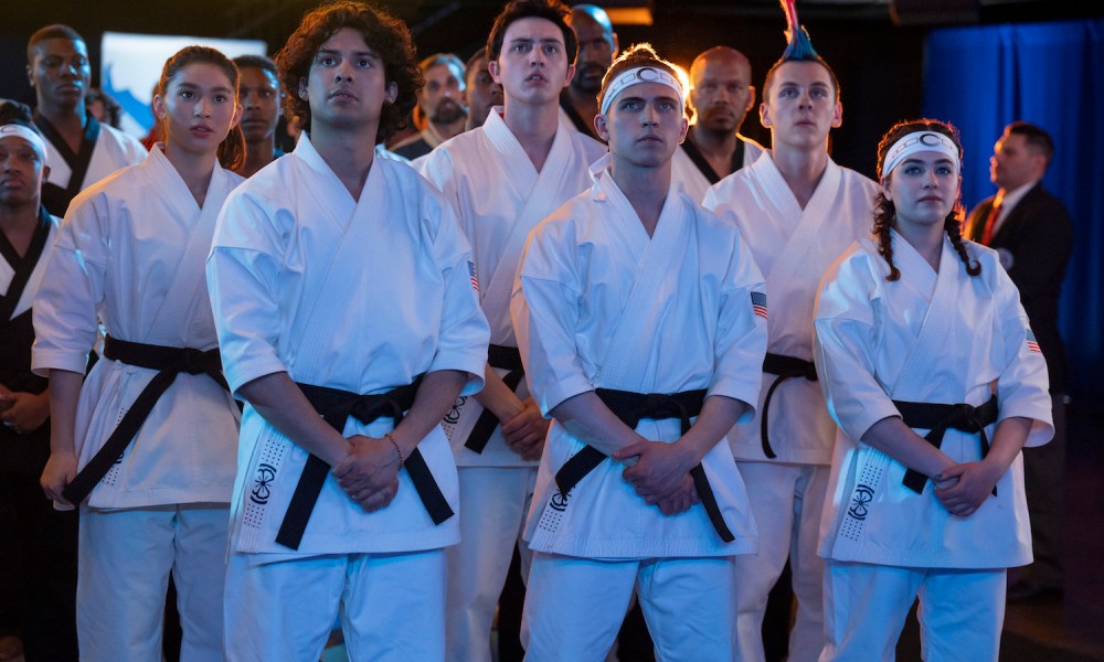 A group of karate students stand together.