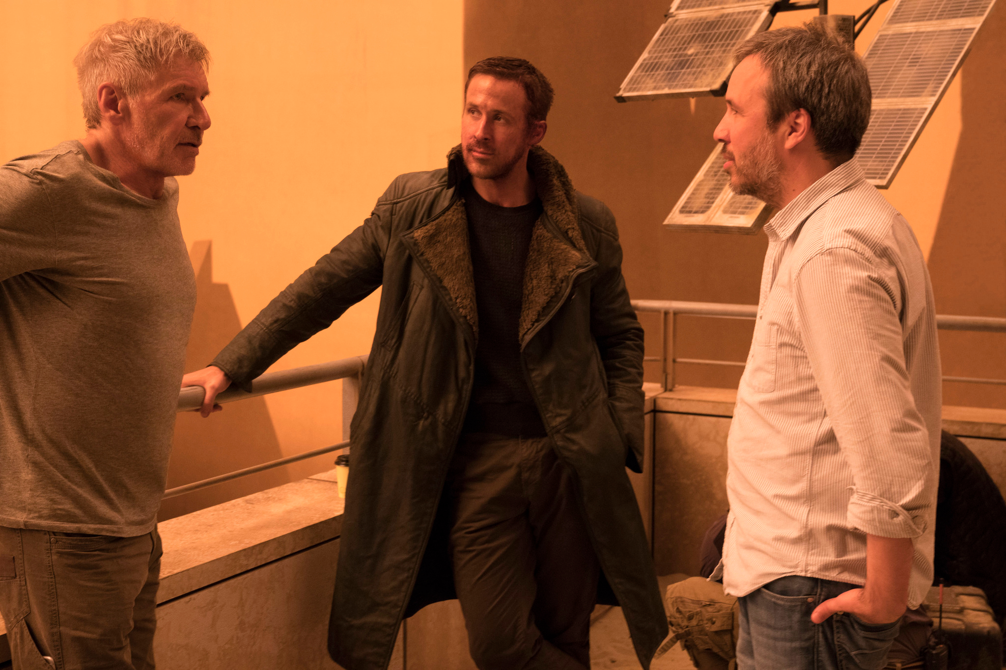 Denis Villeneuve stands with Harrison Ford and Ryan Gosling on the set of Blade Runner 2049.