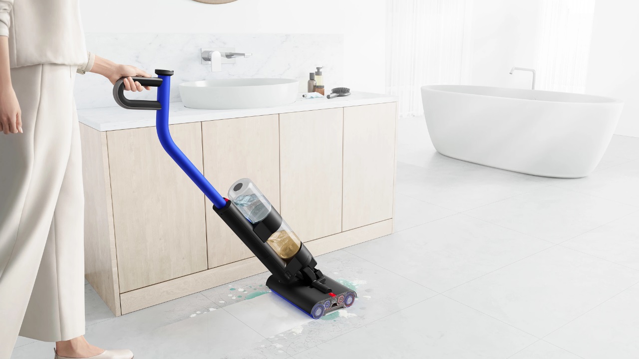 A person pushing the Dyson WashG1.