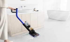 A person pushing the Dyson WashG1.