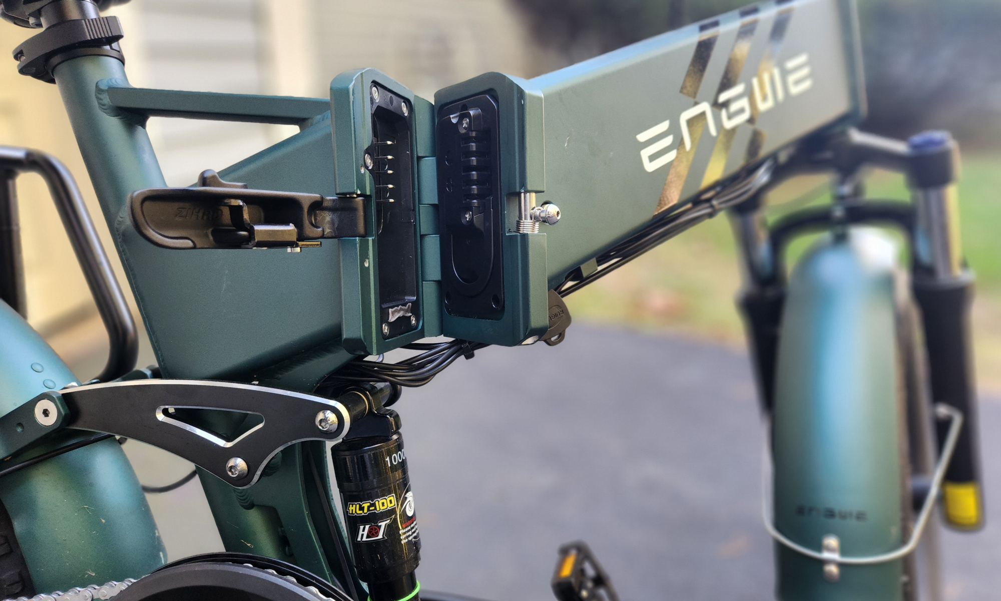 Engwe Engine Pro 2.0 folding bike mid-frame folding mechanism and battery access.