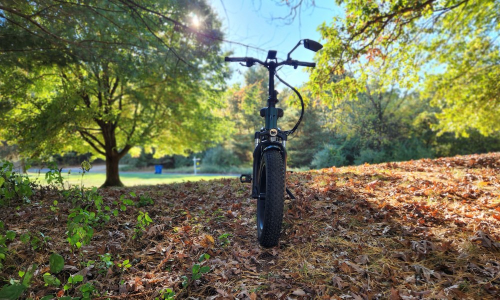 Engwe Engine Pro 2.0 folding bike on the crest of a hill before sundown.