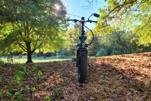 Engwe Engine Pro 2.0 folding bike on the crest of a hill before sundown.