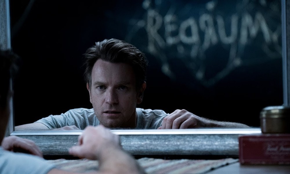 Ewan McGregor as Dan Torrance staring into a mirror in Doctor Sleep.