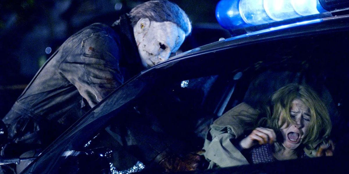 Michael Myers agarra a Laurie en Halloween 2007