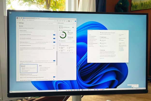 Microsoft Defender and Edge Security settings are open on a PC monitor.