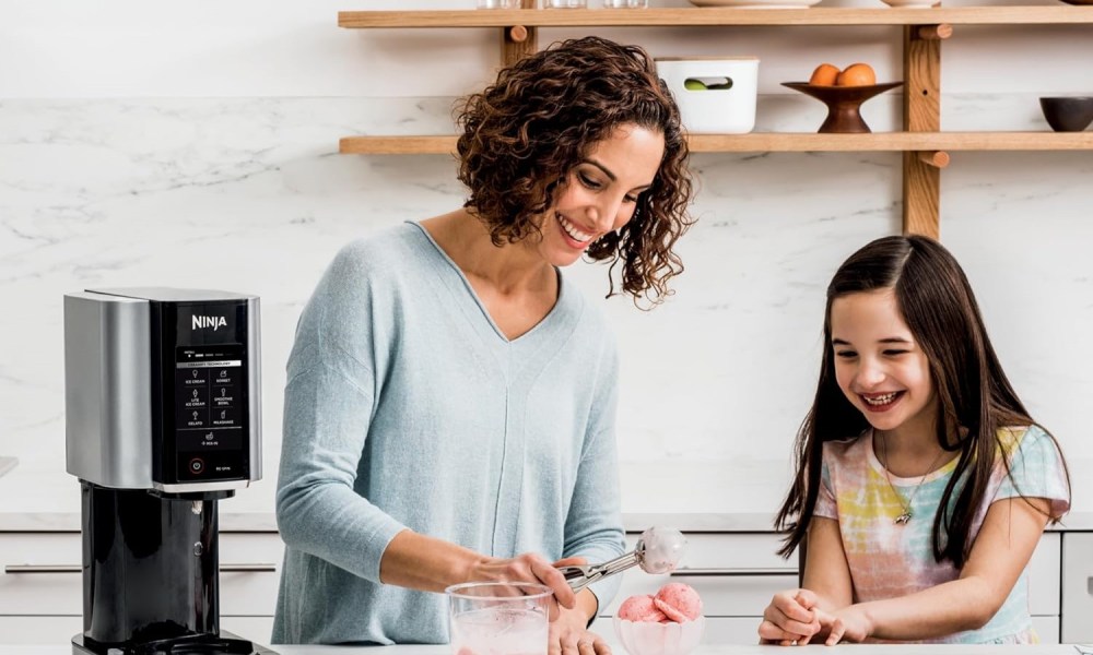 Ninja CREAMi ice cream maker with people using it