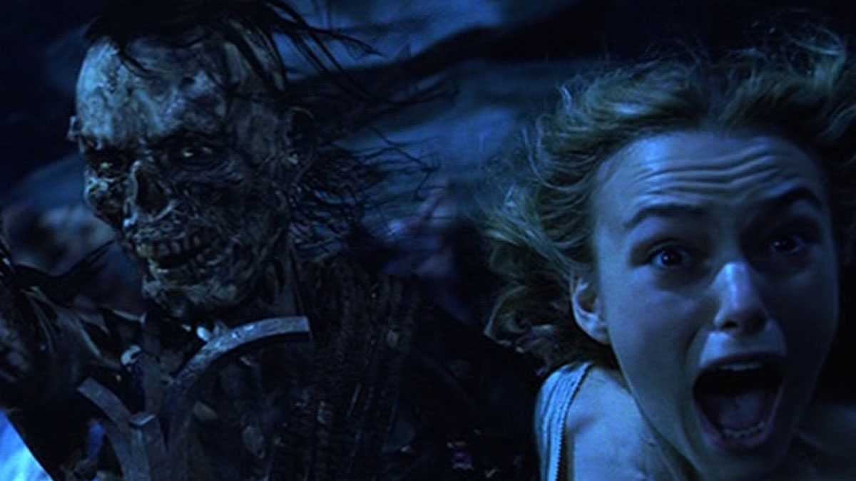 An undead pirate scares Keira Knightley in Pirates of the Caribbean: The Curse of the Black Pearl.