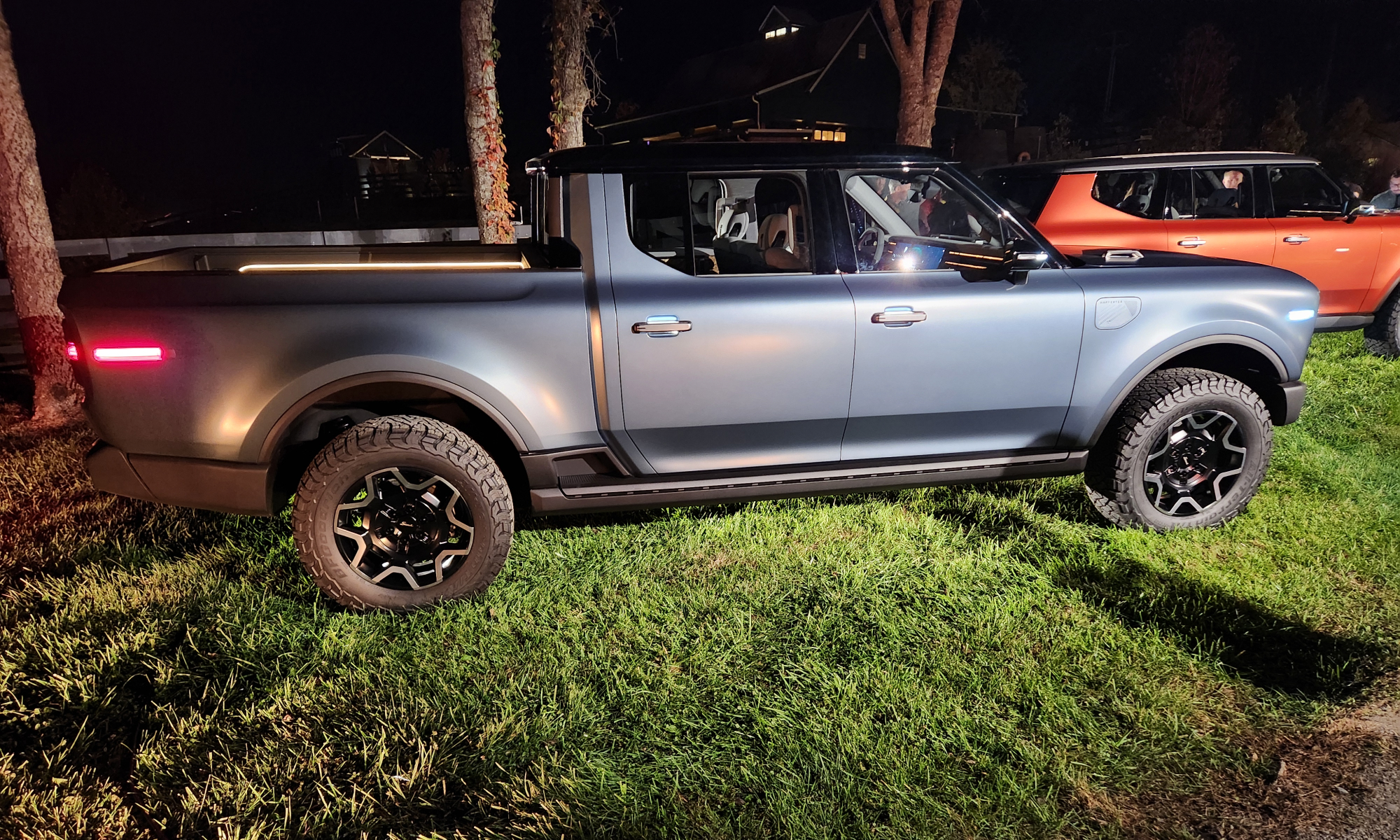 Scout Terra electric truck right profile at night.