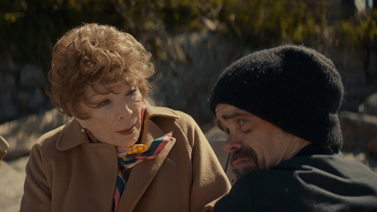 Shirley MacLaine and Peter Dinklage together outside in a scene from American Dreamer.