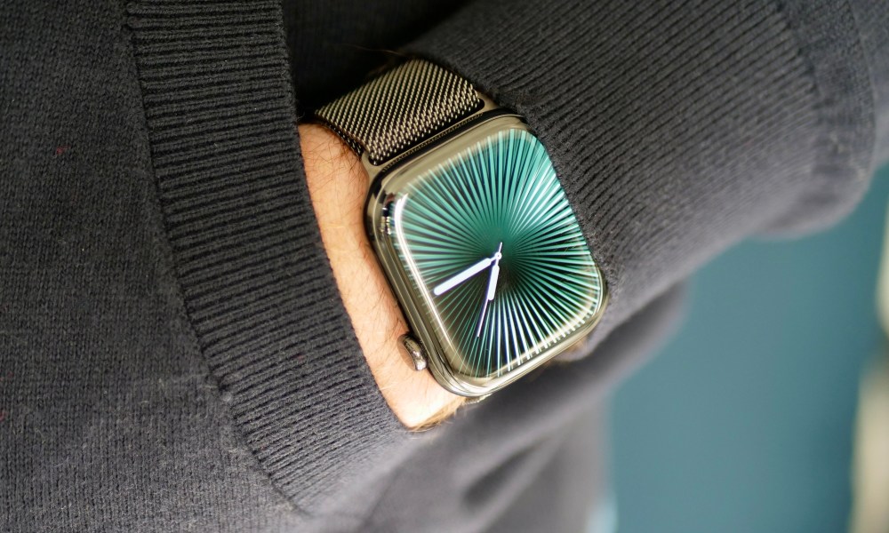 A person wearing the titanium Apple Watch Series 10.