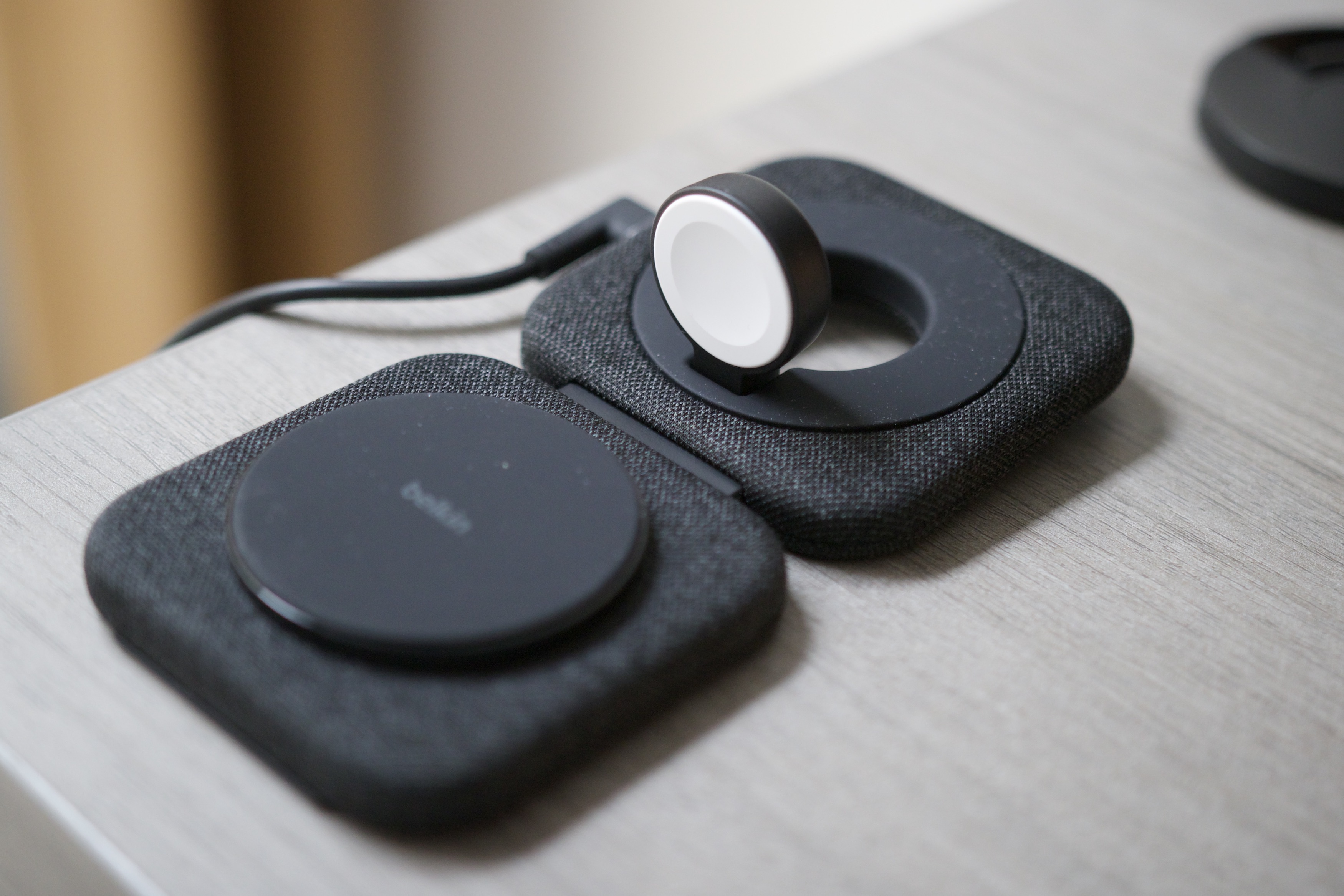 The Belkin Travel Pad opened to reveal its phone and Apple Watch chargers.